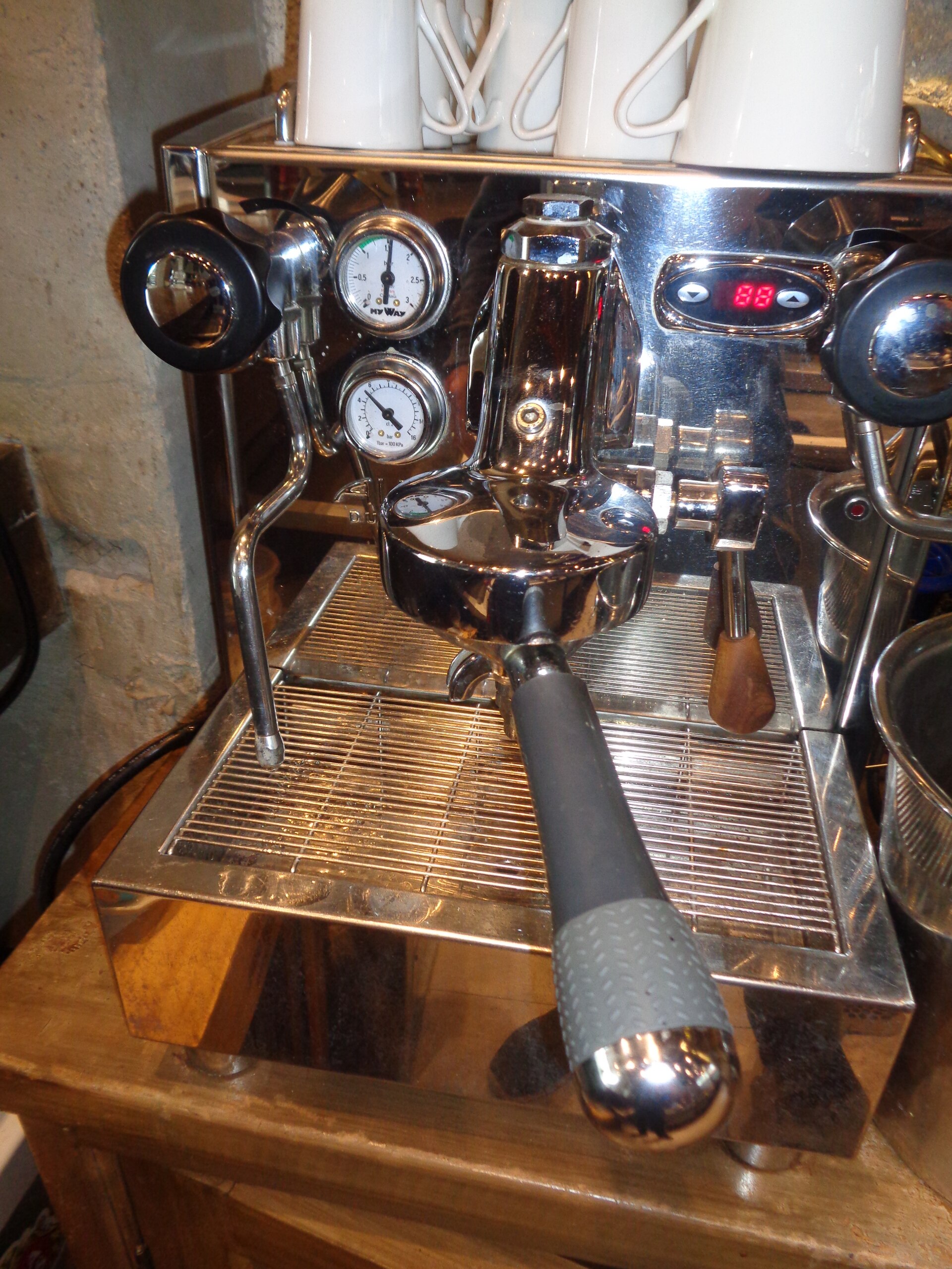 Espresso machine positioned behind a café bar in Quito
